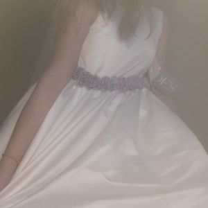 A earl white dress with purple rose details